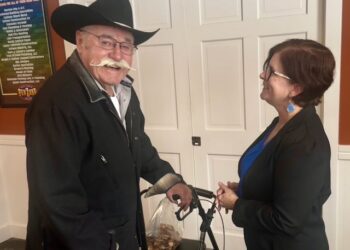 Nikki Gronli, the Democratic candidate running for the U.S. House of Representatives, follows up with Larry Stroschein on agriculture issues after speaking at the Brown County Democratic luncheon. Aberdeen Insider photo by Shannon Marvel.