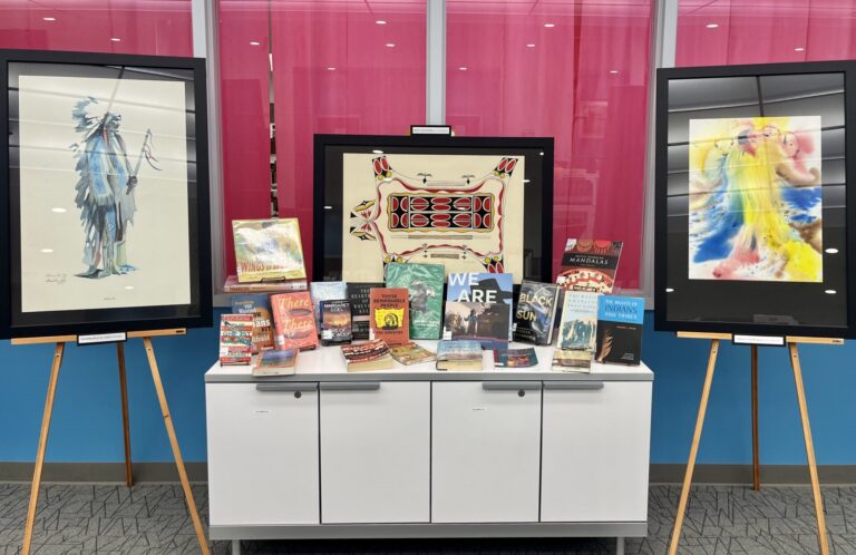 Three paintings by Lakota artists were recently found and are now on display at K.O. Lee Aberdeen Public Library. They include, from left, "Standing Bear" by Arthur Amiotte and "Spirit of the Buffalo" and "Buffalo Calf Woman" by Vic Runnels. Aberdeen Insider photo by Reagan Bierschenk.