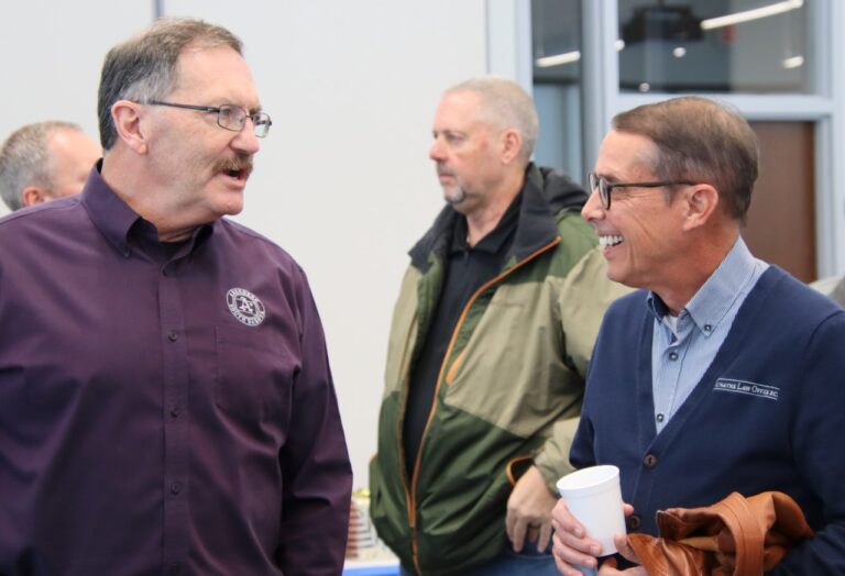 Outgoing City Manager Robin Bobzien visits with City Councilman Rob Ronayne at Bobzien's retirement party Thursday, Dec. 11 at K.O. Lee Aberdeen Public Library. Bobzien worked for the city for more than 30 years. Aberdeen Insider photo by Elisa Sand.