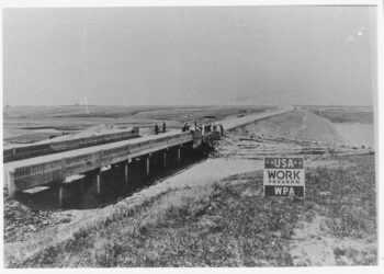Drought-stricken farmers work on Richmond Lake dam in Brown County in the 1930s. Farmers who had been wiped out by drought helped finishe a dam and bridge for a 1,000-acre artificial miles north of Aberdeen. The structure now needs to be replaced. Photo Courtesy of the South Dakota Historical Society.