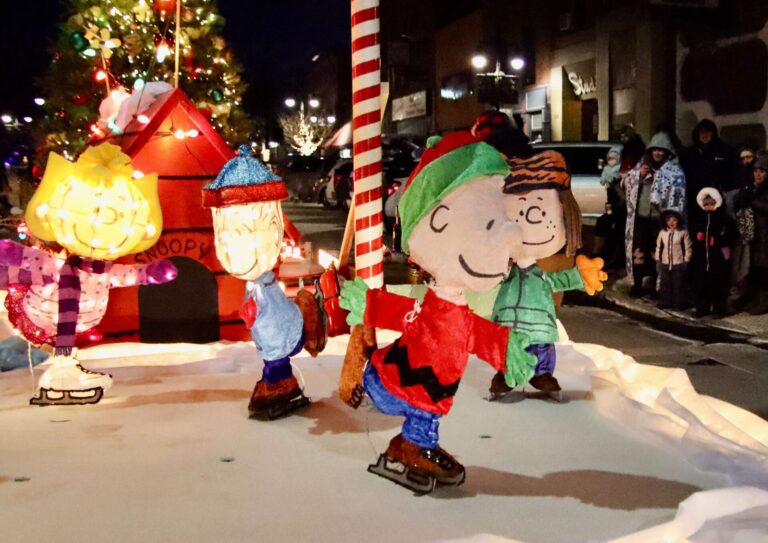 Christmas and holiday revelers braved temperatures barely above zero to watch the annual Parade of Lights, which rolled through downtown Aberdeen the evening of Saturday, Dec. 13. The parade featured vehicles of all kinds — a tractor, a snowmobile, pickups, cars and an Aberdeen Fire & Rescue truck — adorned with lights and decorations. Santa & Mrs. Claus were spotted, while others in the parade tossed out candy and other items to those watching. Aberdeen Insider photos by Scott Waltman and Elisa Sand.