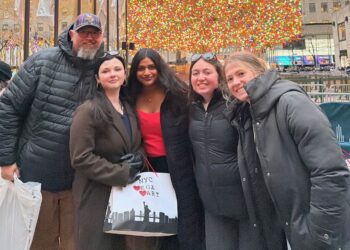 Northern Speech and Debate coach Justin Gus Foote, left, gathers with team members, Haylee Bohnet, Abiah George, Liv Ashley and Hannah Smith while in New York for a December competition. Courtesy photo from Northern State University.