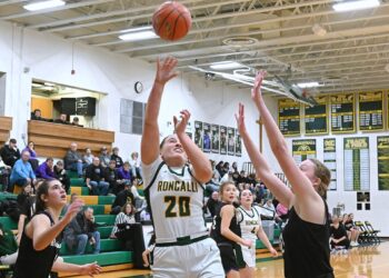 Girls high school basketball: Fast start helps Roncalli tame Mustangs; Central moves to 4-0 3 Aberdeen Roncalli's Rylee Voeller attempts a layup in between Waubay/Summit's Addison Heinje, left, and Mackenzie Zubke during the third quarter of Cavalier Classic Saturday, Dec. 20 at the Roncalli Gym. Voeller had nine points, helping Roncalli to a 48-43 win. Aberdeen Insider photo by Robb Garofalo.