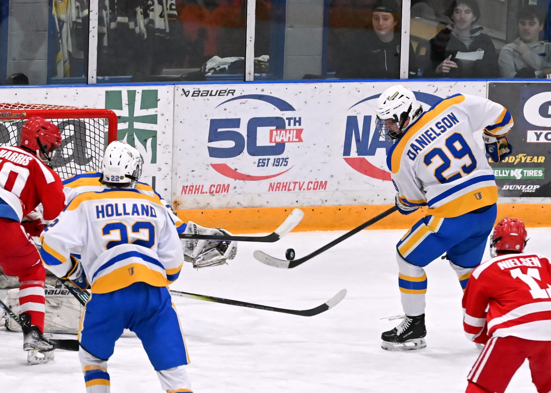 Aberdeen defenseman Jaxon Danielson knocks the puck away from the Cougar goal during the second period against the Brookings Rangers Saturday, Dec. 27 inside the Odde Ice Center. Brookings won 4-0. Aberdeen Insider photo by Robb Garofalo.