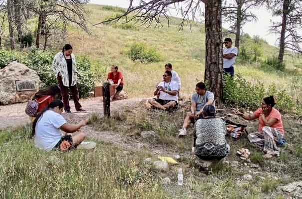 Native leaders teach a group about indigenous flora and fauna in the Black Hills. Photo courtesy of the South Dakota Native Tourism Alliance.