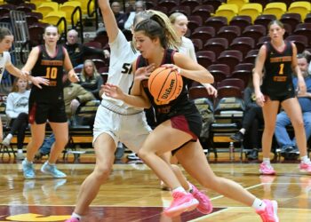 Northern State's Izzy Moore drives to the basket on Southwest Minnesota's Maddie Thorfinnson during the third quarter Saturday, Jan. 31 at Wachs Arena. Moore scored 26 points, helping the Wolves sweep their I Hate Winter games. Aberdeen Insider photo by Robb Garofalo.