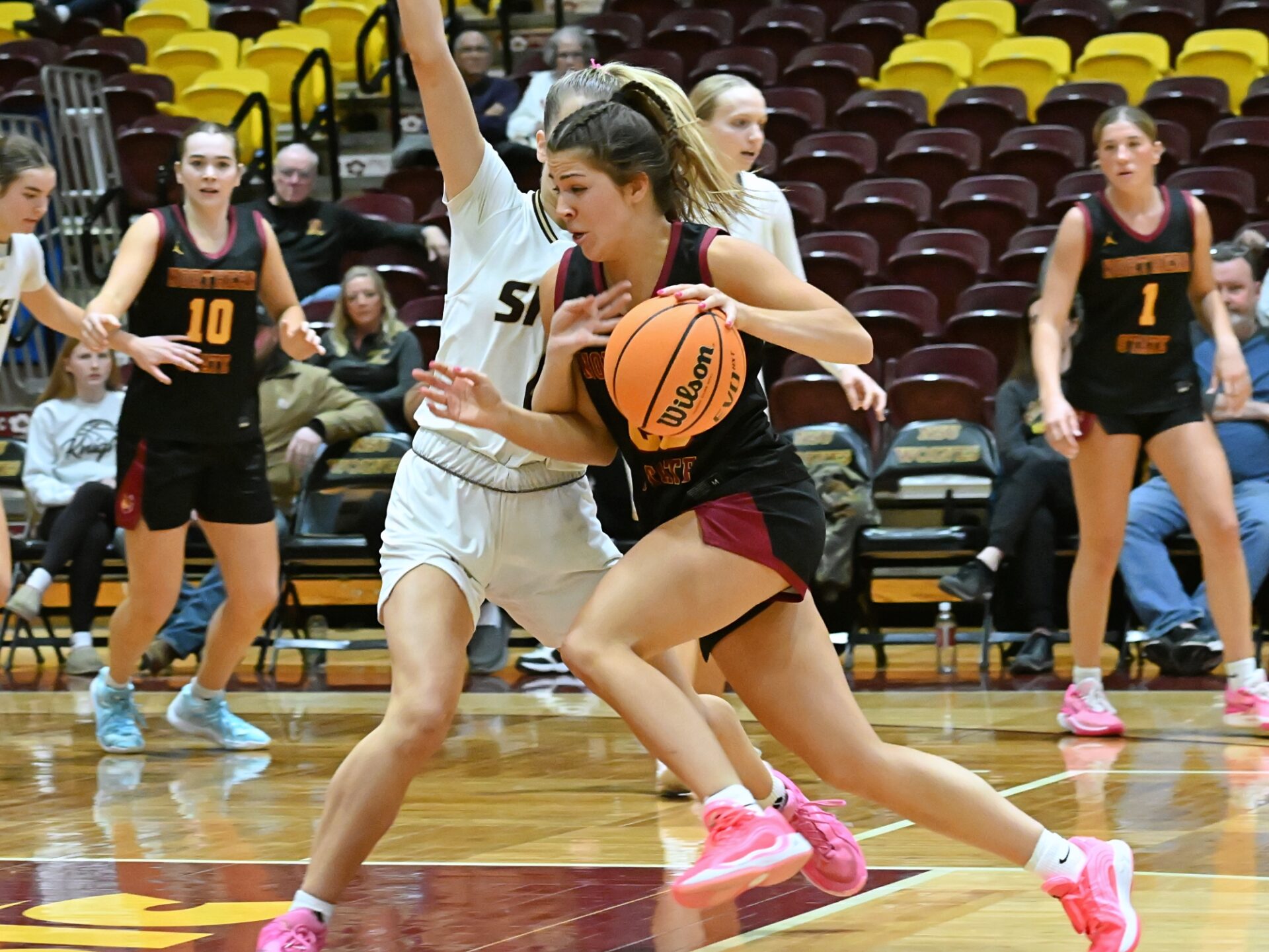 Northern State's Izzy Moore drives to the basket on Southwest Minnesota's Maddie Thorfinnson during the third quarter Saturday, Jan. 31 at Wachs Arena. Moore scored 26 points, helping the Wolves sweep their I Hate Winter games. Aberdeen Insider photo by Robb Garofalo.