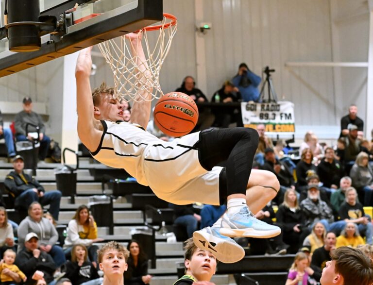 Groton Area's Karson Zak throws down an alley-oop dunk to end the first quarter against Aberdeen Roncalli Tuesday, Feb. 3 in Groton. Zak had three dunks and 18 points in an 83-50 Tiger victory. Aberdeen Insider photo by Robb Garofalo.