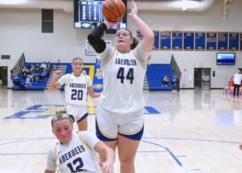 Aberdeen Central's Taryn Hermansen manages to avoid falling teammate Kennadi Withers in the lane and scores on an offensive rebound and put-back against Yankton Saturday, Jan. 3 inside Golden Eagles Arena. Hermansen had a game-high 25 points in a 76-51 Central win. Aberdeen Insider photo by Robb Garofalo.