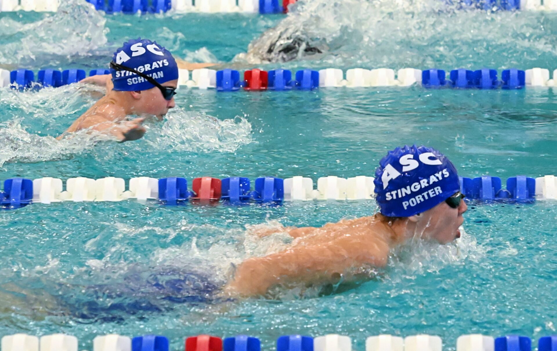 Aberdeen Swim Club's Porter Bindenagel, bottom, maintains his lead over teammate Asher Schwan in the 200-yard individual medley finals during the Winter High Point meet Sunday, Jan. 4 inside the Aberdeen Family YMCA pool. Bindenagel held off Schwan for the win. Aberdeen Insider photo by Robb Garofalo.