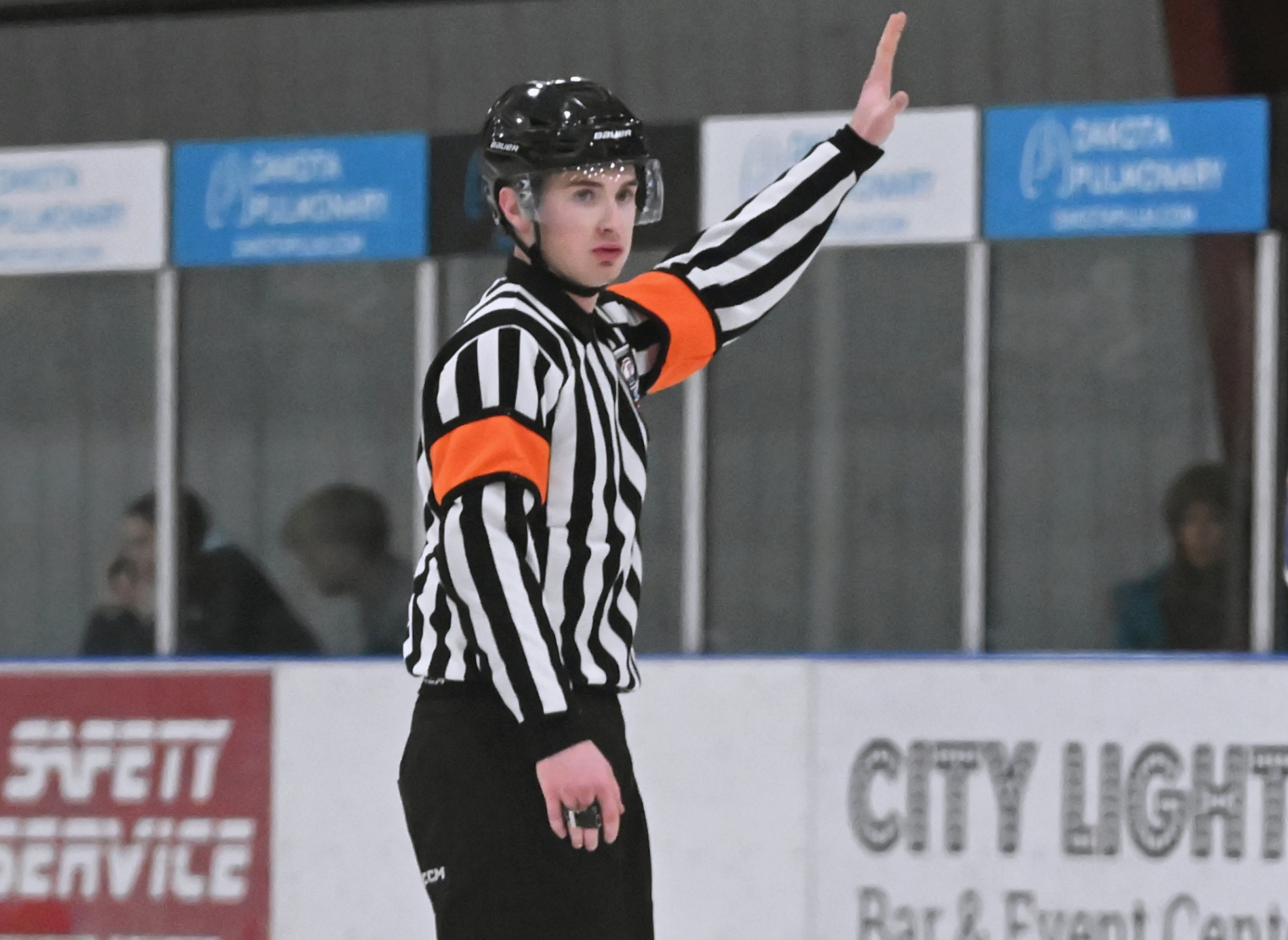 Aberdeen's Gannon May holds up play during the Aberdeen Cougars/Brooking Rangers boys game Saturday, Dec. 27 inside the Odde Ice Center. It was May's first game as a varsity referee. Aberdeen Insider photo by Robb Garofalo.