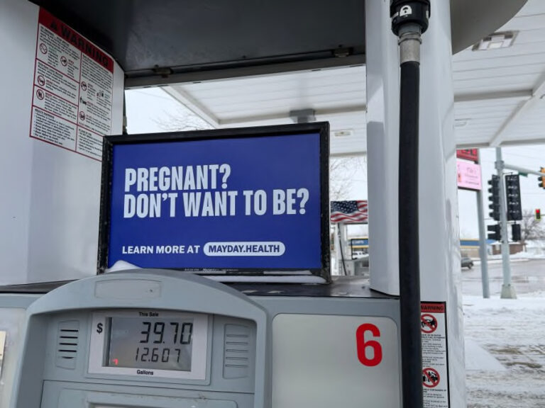 Mayday Health posted signs like this one at gas stations around South Dakota in December 2025 as part of a campaign to spread awareness about the availability of abortion pills. Photo courtesy of Mayday Health.