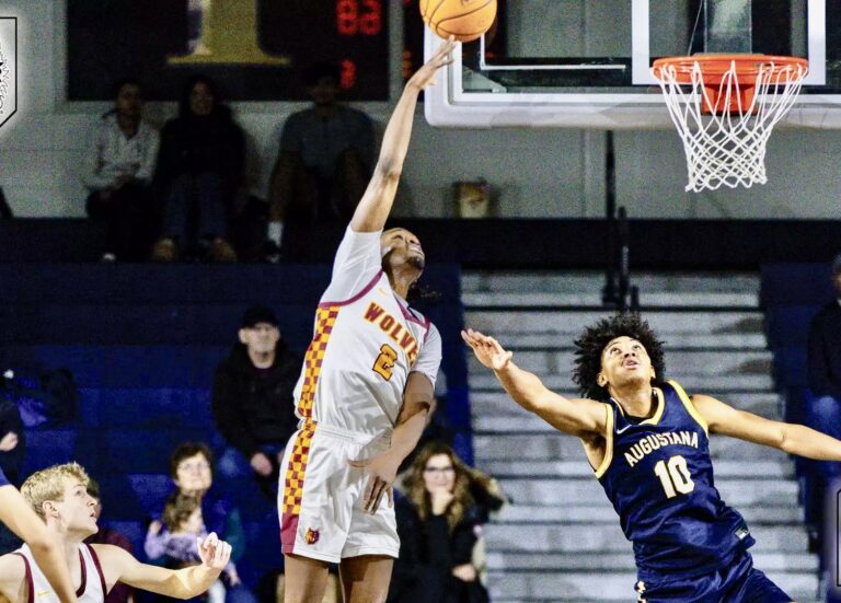 Marshawn Smith of Northern State takes a shot against Augustana's Amari Westmoreland-Vendiola during the Wolves' 91-88 victory Saturday, Dec. 10 in Sioux Falls. Photo courtesy of Bartsch Photography.