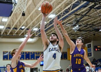 Aberdeen Central's Brenner Waldrop scores two of his eight points on a drive in between Watertown's Dane Stark, right, and Isaac Rehorst during the fourth quarter Tuesday, Jan. 13 at Golden Eagles Arena. Watertown picked up a 59-45 win. Aberdeen Insider photo by Robb Garofalo.
