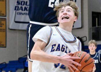 Aberdeen Central forward Liam Rife drives to the hoop while Tea's Lane Sieber leaps in an attempt to block the shot in the Titans' 64-43 triumph on Saturday, Jan. 17 at Golden Eagles Arena. Aberdeen Insider photo by Scott Waltman.