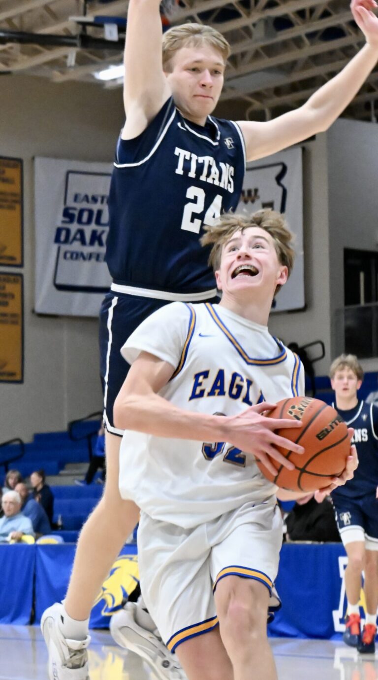 Aberdeen Central forward Liam Rife drives to the hoop while Tea's Lane Sieber leaps in an attempt to block the shot in the Titans' 64-43 triumph on Saturday, Jan. 17 at Golden Eagles Arena. Aberdeen Insider photo by Scott Waltman.