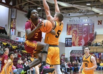 Northern State's Marshawn Smith hangs in the air on a layup attempt while defended by Concordia-St. Paul's Ben Kopetzki during the second half of the Wolves' 78-73 loss Saturday, Jan. 17 at Wachs Arena. Aberdeen Insider photo by Robb Garofalo.