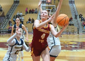 Northern State's Morgan Fiedler drives and scores past Concordia-St. Paul's Lydia Haack during the fourth quarter Saturday, Jan. 17 at Wachs Arena. Northern would lost 78-51. Aberdeen Insider photo by Robb Garofalo.
