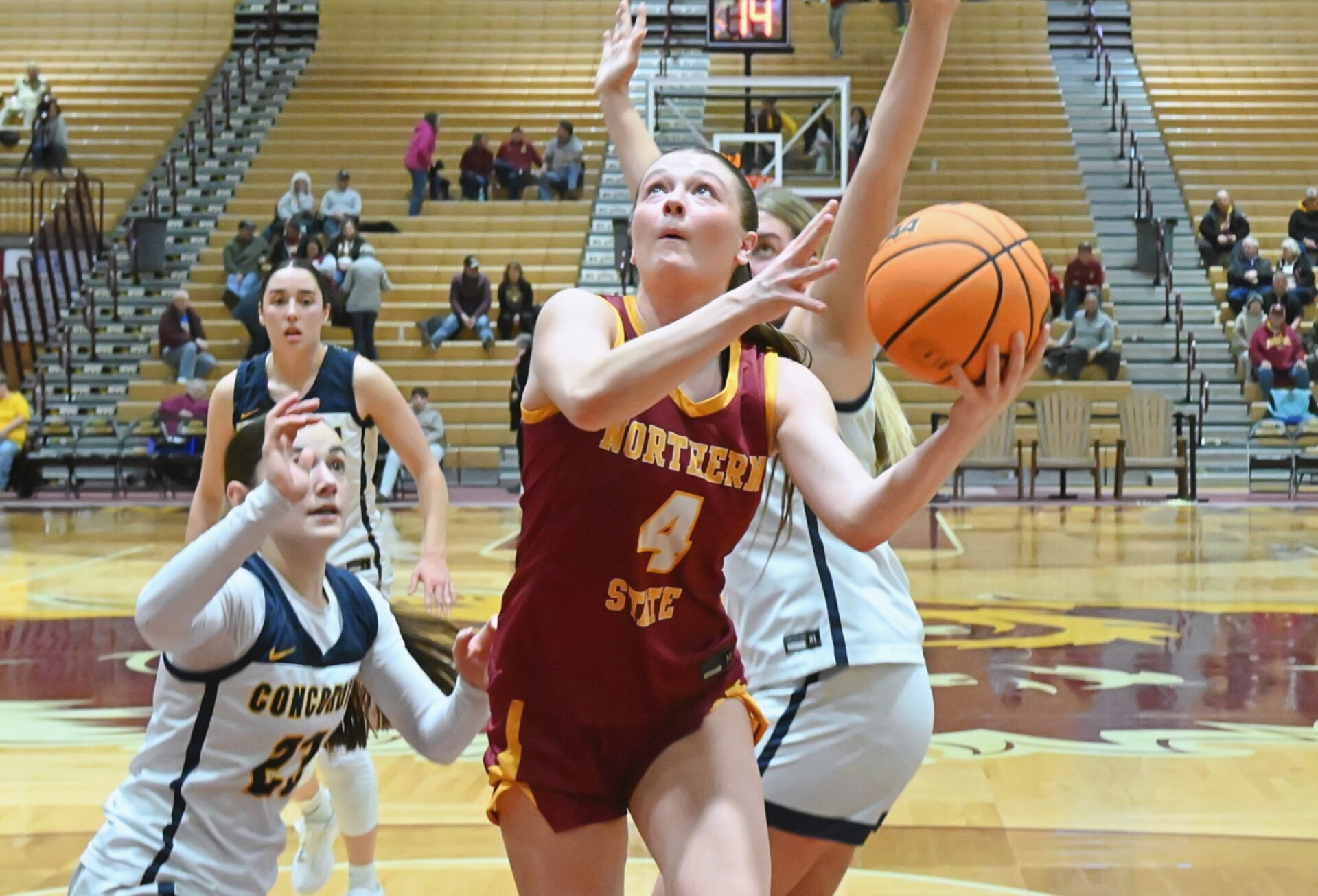 Northern State's Morgan Fiedler drives and scores past Concordia-St. Paul's Lydia Haack during the fourth quarter Saturday, Jan. 17 at Wachs Arena. Northern would lost 78-51. Aberdeen Insider photo by Robb Garofalo.