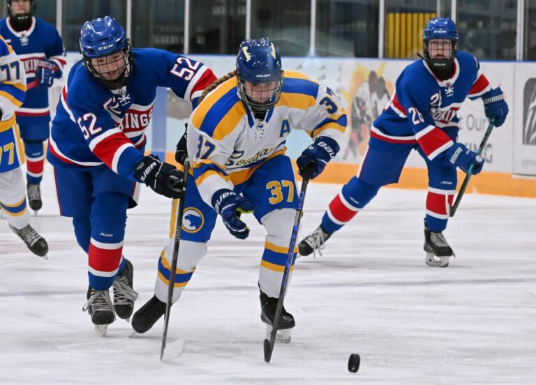 Aberdeen forward Olivia Sandvig outraces Brookings defender Audrey Andal to the puck during the third period of their game Friday, Jan. 23 at the Odde Ice Center. Brookings claimed a 2-0 win. Aberdeen Insider photo by Robb Garofalo.