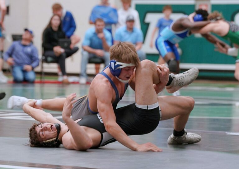 Aberdeen Central's Grayden Timm rolls Sturgis' Gavin Werlinger en route to a pin during the East vs. West Duals Saturday, Jan. 24 in Pierre. Photo by Kevin Foss for The Aberdeen Insider.