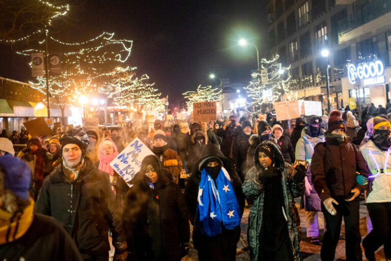Hundreds gather around a growing memorial site at 26th Street and Nicollet Avenue South in Minneapolis, where federal agents shot and killed Alex Pretti Saturday, Jan. 24 earlier in the day. Minnesota Reformer photo by Nicole Neri.