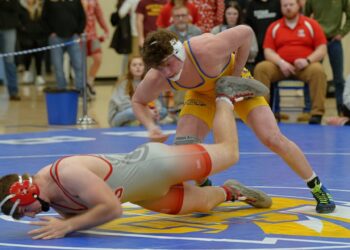 Aberdeen Central's Owen Ward hooks the leg of Chamberlain's Chisum Blum in their 190-pound final during the Lee Wolf Invitational Saturday, Jan. 31 at Golden Eagles Arena. Ward won the match by fall. Photo by Kevin Foss for the Aberdeen Insider.
