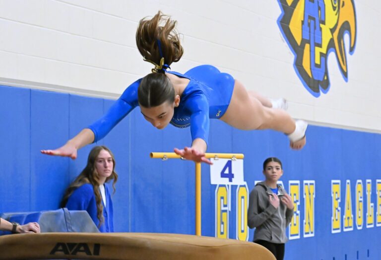 Aberdeen Central's Morgan Griebel propels herself toward the vault during the Eastern south Dakota Conference gymnastics meet Saturday, Jan. 31 at Aberdeen Central High School. Aberdeen Insider photo by Robb Garofalo.