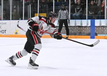 Aberdeen defenseman Cooper Anderson shoots and scores the game-winning goal in overtime Saturday, Jan. 31 against the Bismarck Bobcats at the Odde Ice Center. Aberdeen Insider photo by Robb Garofalo.