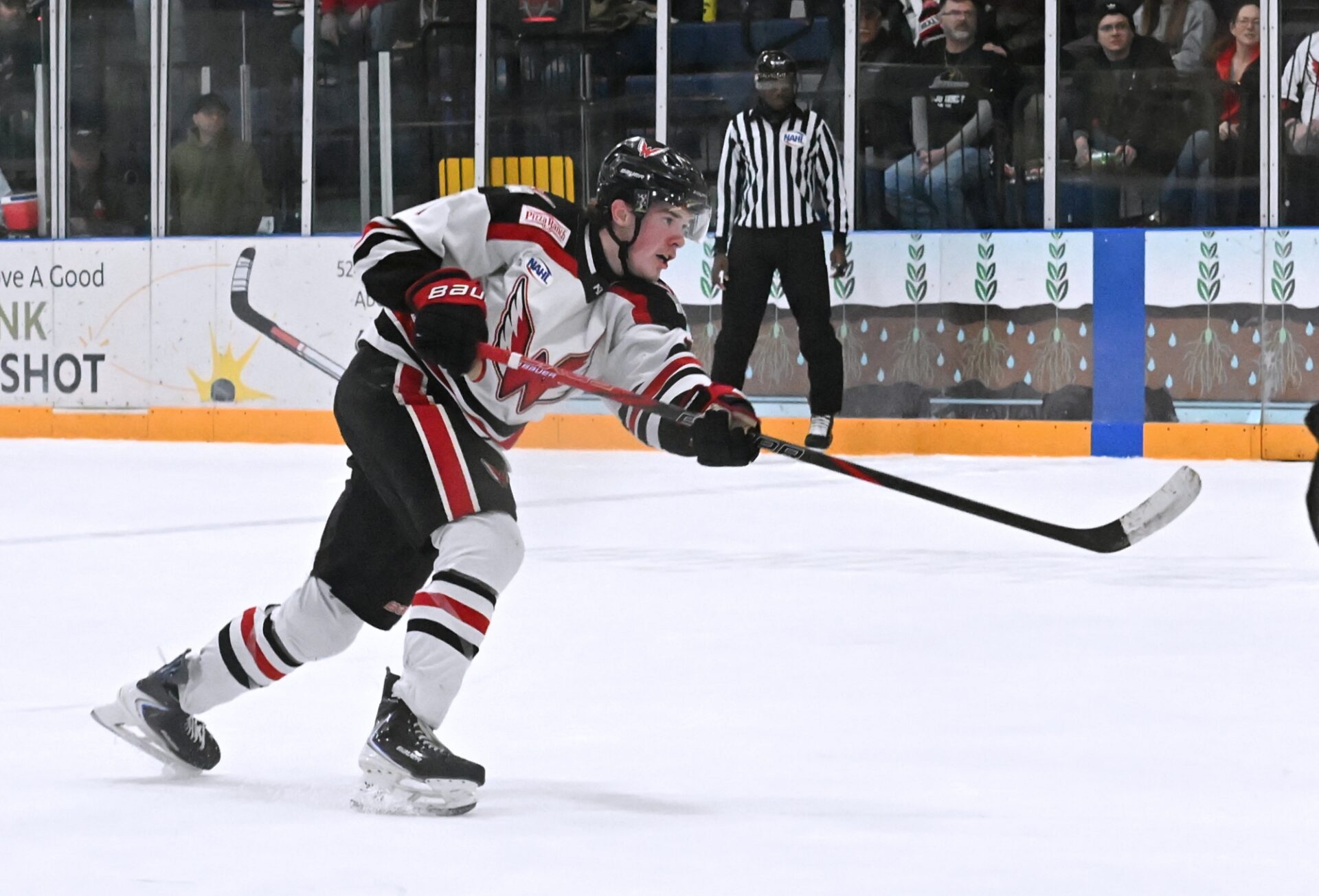 Aberdeen defenseman Cooper Anderson shoots and scores the game-winning goal in overtime Saturday, Jan. 31 against the Bismarck Bobcats at the Odde Ice Center. Aberdeen Insider photo by Robb Garofalo.