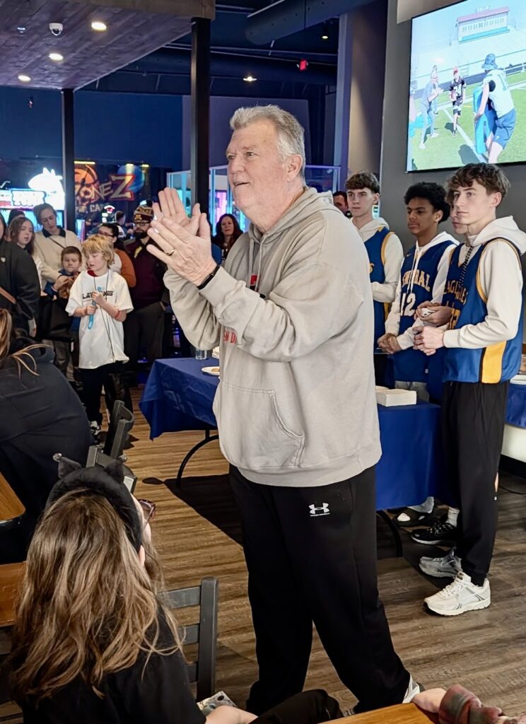 Greg Roeszler addresses the crowd at the beginning of the Playmakers event the morning of Saturday, Jan. 31 at Allevity. During the event, local high school athletes teamed up with kids who have special needs to play arcade games. Aberdeen Insider photo by Scott Waltman.
