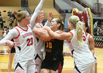 Northern State's Lily Klein battles, from left, MSU Moorhead's Abby Berge, Terryn Johnson and Caylin Kelly for a rebound during the first quarter of the Wolves' 61-41 win Saturday, Feb. 7 inside Wachs Arena. Klein grabbed the ball and drew a foul on Kelly. Aberdeen Insider photo by Robb Garofalo.