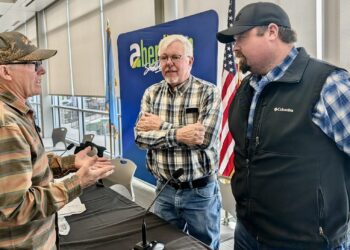 State Rep. Scott Moore, R-Ipswich, center, and Sen. Mark Lapka, R-Long Lake, visit with a constituent after the first legislative coffee on Saturday, Feb. 7 at the Barnett Center.