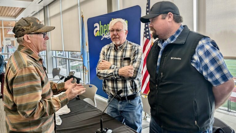 State Rep. Scott Moore, R-Ipswich, center, and Sen. Mark Lapka, R-Long Lake, visit with a constituent after the first legislative coffee on Saturday, Feb. 7 at the Barnett Center.
