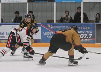 Aberdeen Wings forward Jibber Kuhl reaches out and deflects the puck into the empty net during the third period against the Minot Minotauros Saturday, Feb. 7 inside the Odde Ice Center. The Wings won the game 6-3. Aberdeen Insider photo by Robb Garofalo.