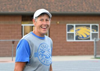 Aberdeen Central Athletic Director Dawn Seiler takes a moment to smile for the camera during the Al Sahli Invitational track meet Friday, May 9, 2025, at the Brownell Activities Complex at Aberdeen Central High School. Seiler is retiring at the end of the 2025-26 school year. Aberdeen Insider photo by Robb Garofalo.