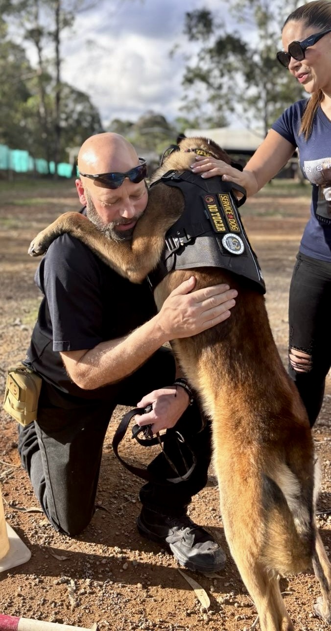 During a moment of stress, Chris Reder is comforted by his therapy dog Cairo for the first time in Florida. Courtesy photo.