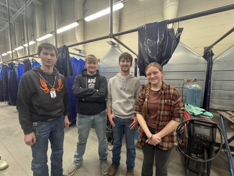 Cody Edward, Bryson Law, Corbin Landis and Elizabeth Preszler stand in the welding shop at the ATEC Academy on the Central High School campus. They are members of the Iron Eagles welding club. Aberdeen Insider photo by Shannon Marvel.