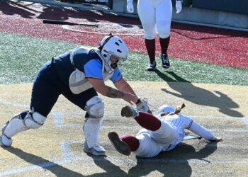 Northern State's Madi Jones slides into home past the tag of Mount Marty catcher Makayla Hudson to score the game-winning run in the bottom of the eighth inning Sunday, Feb. 15 inside Koehler Hall of Fame Field. Northern won the 4-3 in eight innings. Aberdeen Insider photo by Robb Garofalo.