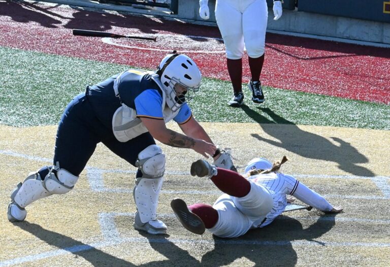 Northern State's Madi Jones slides into home past the tag of Mount Marty catcher Makayla Hudson to score the game-winning run in the bottom of the eighth inning Sunday, Feb. 15 inside Koehler Hall of Fame Field. Northern won the 4-3 in eight innings. Aberdeen Insider photo by Robb Garofalo.
