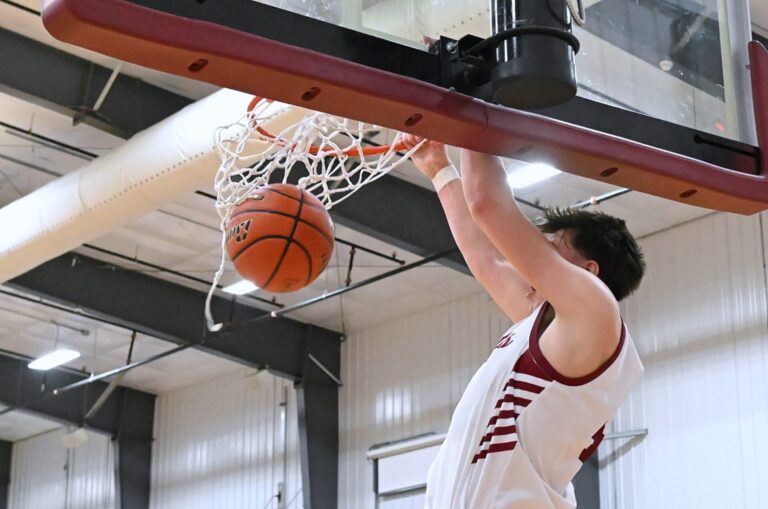 Brooks Jett throws down two of his game-high 22 points in Aberdeen Christian's 65-58 overtime win over Hitchcock-Tulare Monday, Feb. 16 at Aberdeen Christian Gym. Aberdeen Insider photo by Robb Garofalo.