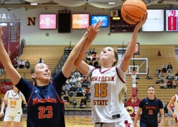 Northern State's Megan Counts drives on the University of Mary's Emily Jaenke during the fourth quarter of their game Thursday, Feb. 19 inside Wachs Arena. Counts had eight points and eight rebounds, but Northern lost 79-69 in overtime. Aberdeen Insider photo by Robb Garofalo.