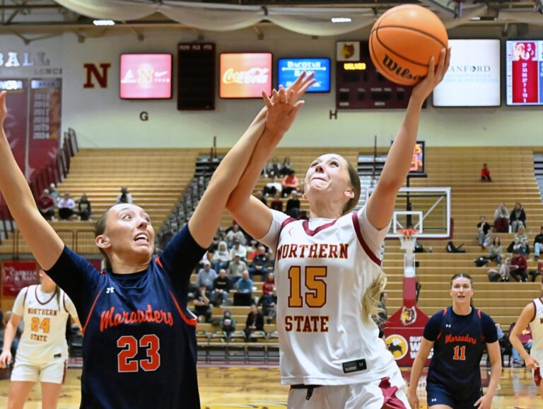 Northern State's Megan Counts drives on the University of Mary's Emily Jaenke during the fourth quarter of their game Thursday, Feb. 19 inside Wachs Arena. Counts had eight points and eight rebounds, but Northern lost 79-69 in overtime. Aberdeen Insider photo by Robb Garofalo.