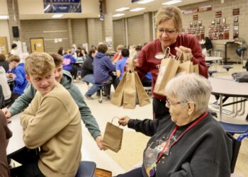 Primrose resident Louise Hoffman hands gift bags to Central High School students Drake Soderlund, left, and Jackson Post on Random Acts of Kindness Day, which was Tuesday, Feb. 17. Photo courtesy of Aberdeen Public Schools.