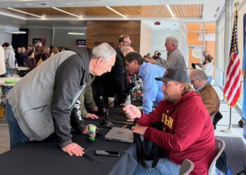Constituents visit with local legislators, front to back, Sen. Michael Rohl, R-Abedeen; Rep. Al Novstrup, R-Aberdeen; Sen. Carl Perry, R-Aberdeen; and Rep. Scott Moore, R-Ipswich, Saturday, Feb. 23 during a legislative coffee session at the Kessler's Champions Club at the Barnett Center. Aberdeen Insider photo by Elisa Sand.