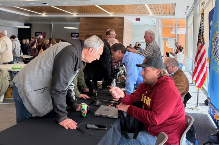 Constituents visit with local legislators, front to back, Sen. Michael Rohl, R-Abedeen; Rep. Al Novstrup, R-Aberdeen; Sen. Carl Perry, R-Aberdeen; and Rep. Scott Moore, R-Ipswich, Saturday, Feb. 23 during a legislative coffee session at the Kessler's Champions Club at the Barnett Center. Aberdeen Insider photo by Elisa Sand.