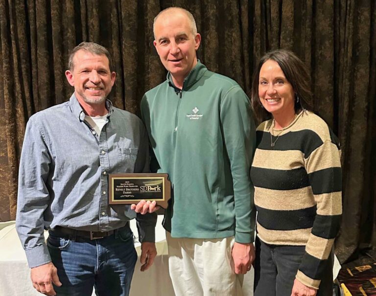 Brian Renelt of Wilmot, left, was named one of three 2025 South Dakota Master Pork Producers at the South Dakota Pork Congress in Sioux Falls on Jan. 14. Also pictured are Mark Vanderwerf, president of the South Dakota Master Pork Producers Association, and Cheryl Renelt, Brian's wife. Photo courtesy of SDSU Extension.