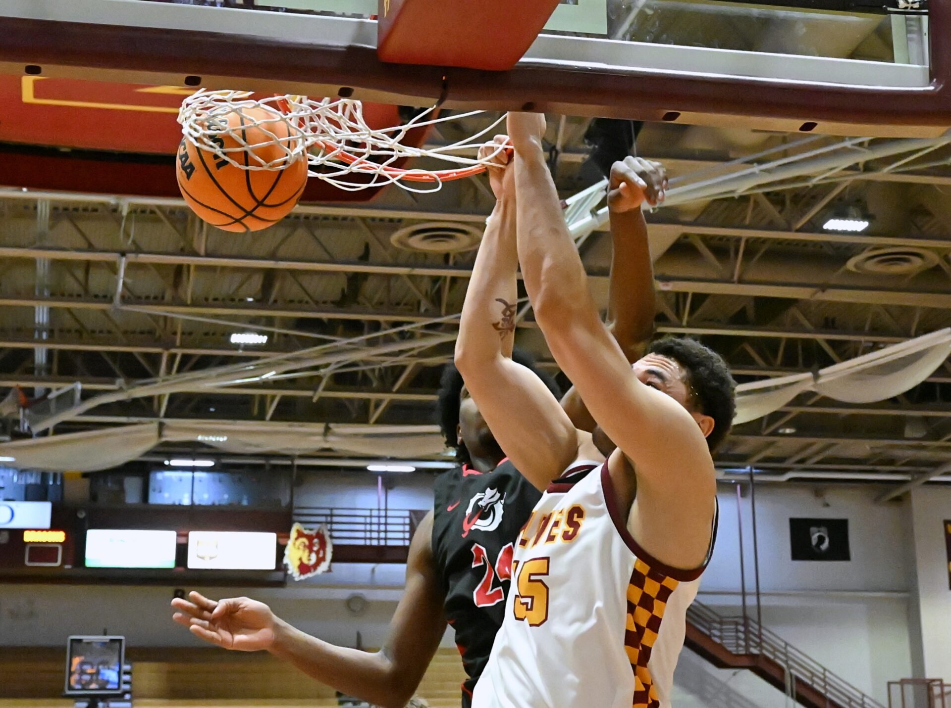 Tobi Obiora slams down two of his nine points in front of Minnesota State Moorhead's Kabine Kaba during their Northern Sun Intercollegiate Conference Tournament game Wednesday, Feb. 25 inside Wachs Arena. Northern came up short, ending its season with a 68-64 loss. Aberdeen Insider photo by Robb Garofalo.