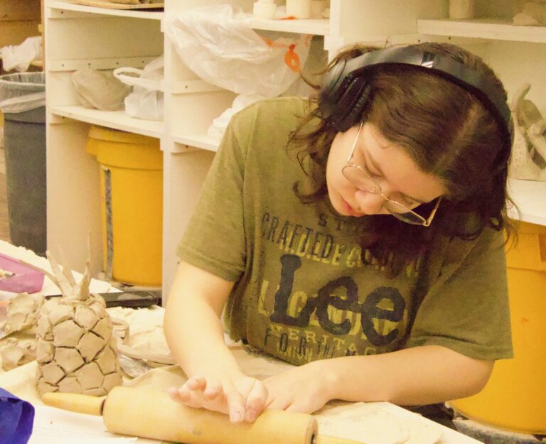 Aberdeen Central student April Flint works on her pineapple during the region ArtWars contest at Northern State University on Friday, Feb. 27. Aberdeen Insider photo by Elisa Sand.