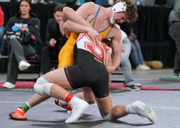 Aberdeen Central's Owen Ward battles Kelson Dirk of Sturgis in the Class A 190-pound state title match Saturday, Feb. 28 in Sioux Falls. Ward battled back from 10-1 and 11-4 deficits to capture a 14-11 victory in overtime. Photo by Kevin Foss for the Aberdeen Insider.